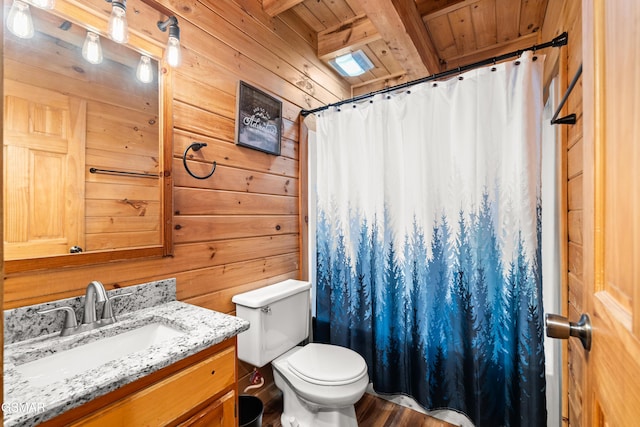 full bath featuring curtained shower, wood walls, toilet, wooden ceiling, and vanity