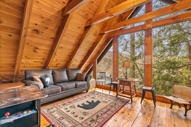 living area with wood ceiling, vaulted ceiling with beams, and hardwood / wood-style flooring