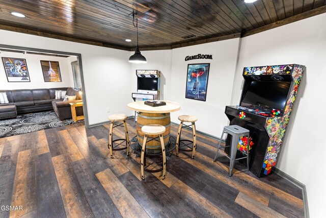 game room with dark wood-style floors, recessed lighting, wooden ceiling, and baseboards