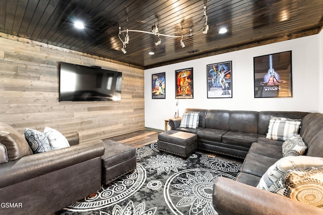 living room with wood walls, wood ceiling, wood finished floors, and recessed lighting