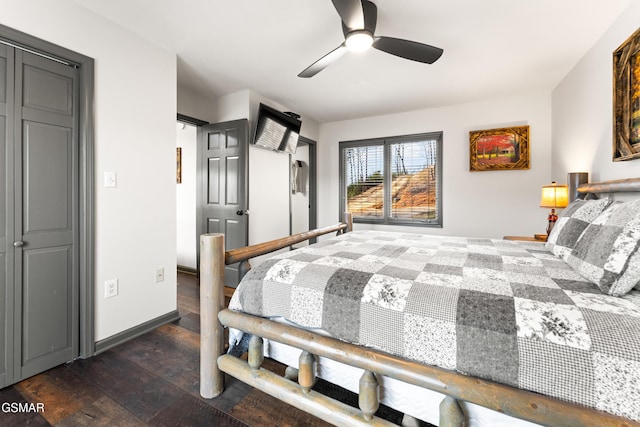 bedroom featuring ceiling fan, baseboards, and dark wood finished floors