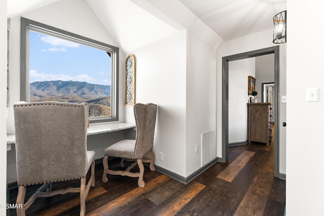 dining area featuring lofted ceiling, baseboards, visible vents, and dark wood-style flooring