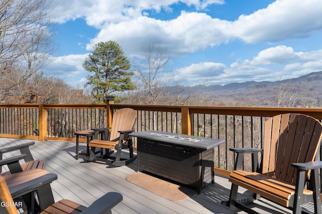 wooden deck with a mountain view