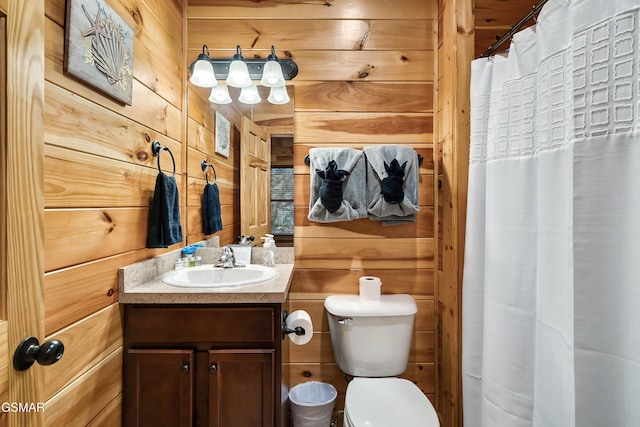852 Resort Way, Gatlinburg, TN 37738 - full bathroom featuring wood walls, vanity, toilet, and a shower with curtain