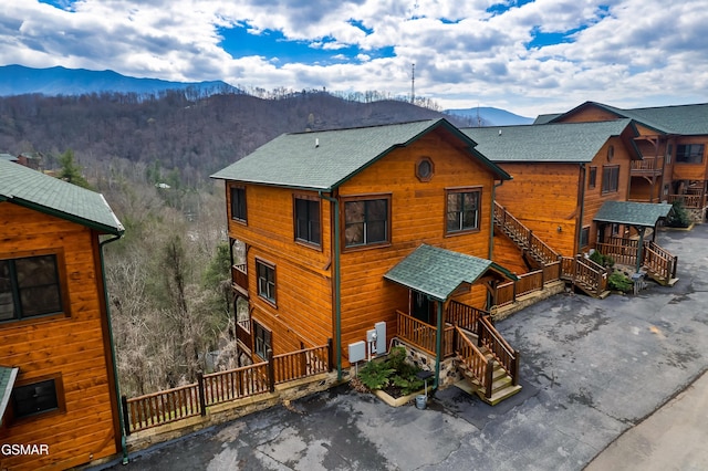 852 Resort Way, Gatlinburg, TN 37738 - rear view of house with a mountain view, a shingled roof, and stairway