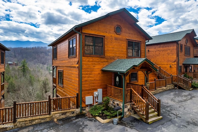 852 Resort Way, Gatlinburg, TN 37738 - chalet / cabin featuring a mountain view, stairway, and roof with shingles