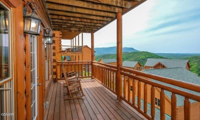 wooden deck featuring a mountain view