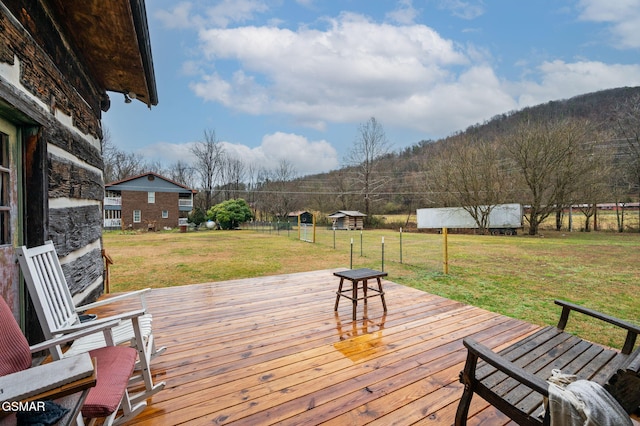 wooden deck with a lawn