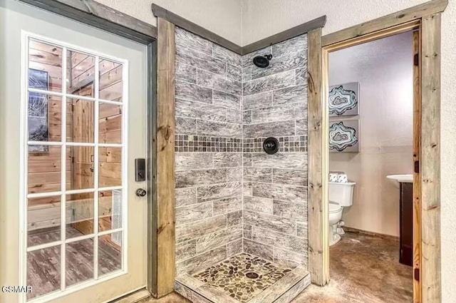 full bathroom with a shower stall and toilet