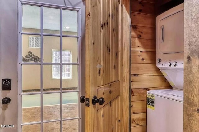 washroom with laundry area and stacked washer and dryer