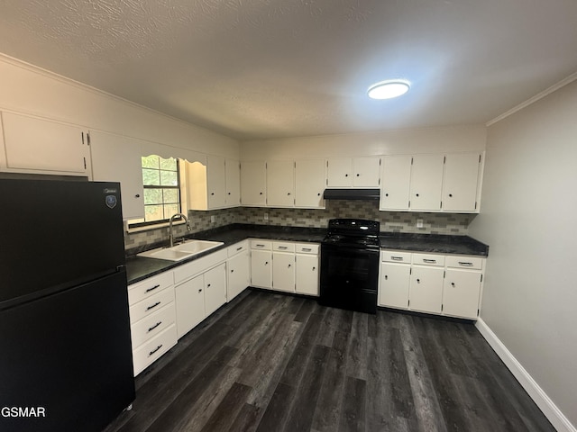 525 Freeman Ave, Newport, TN 37821 - kitchen with black appliances, a sink, dark wood finished floors, dark countertops, and under cabinet range hood