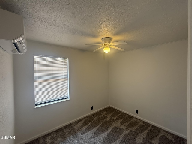 525 Freeman Ave, Newport, TN 37821 - empty room featuring dark carpet, a ceiling fan, a wall unit AC, baseboards, and a textured ceiling