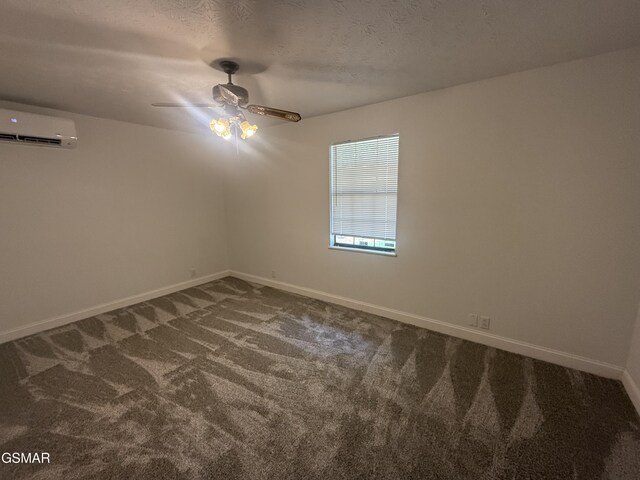 525 Freeman Ave, Newport, TN 37821 - carpeted empty room with an AC wall unit, baseboards, and ceiling fan