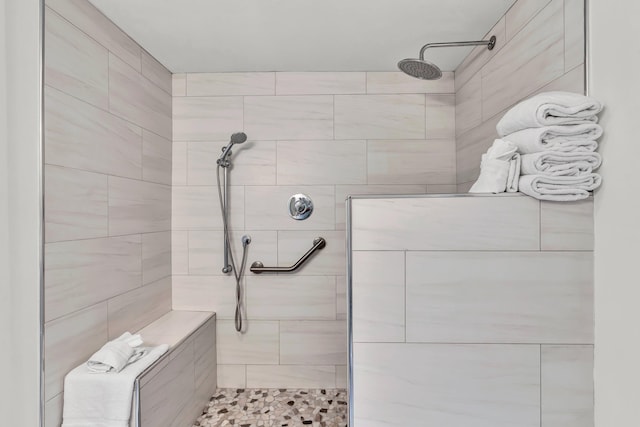 bathroom with tiled shower