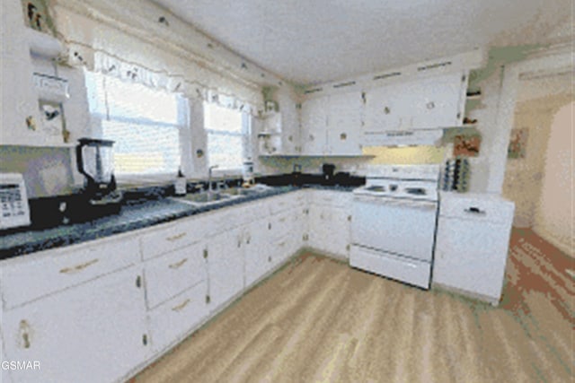 kitchen with white cabinets, sink, light wood-type flooring, range hood, and white range with electric stovetop