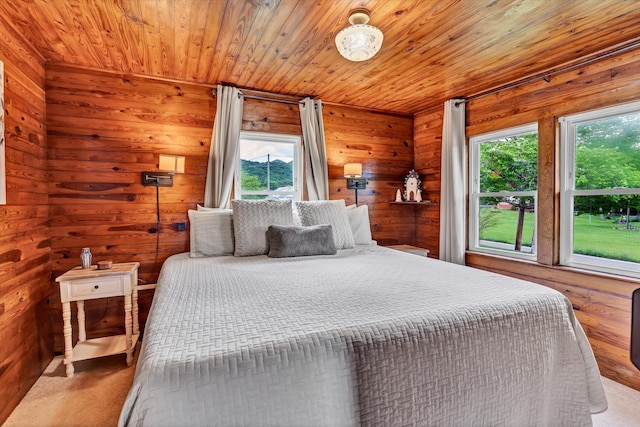 bedroom with light carpet and wooden ceiling