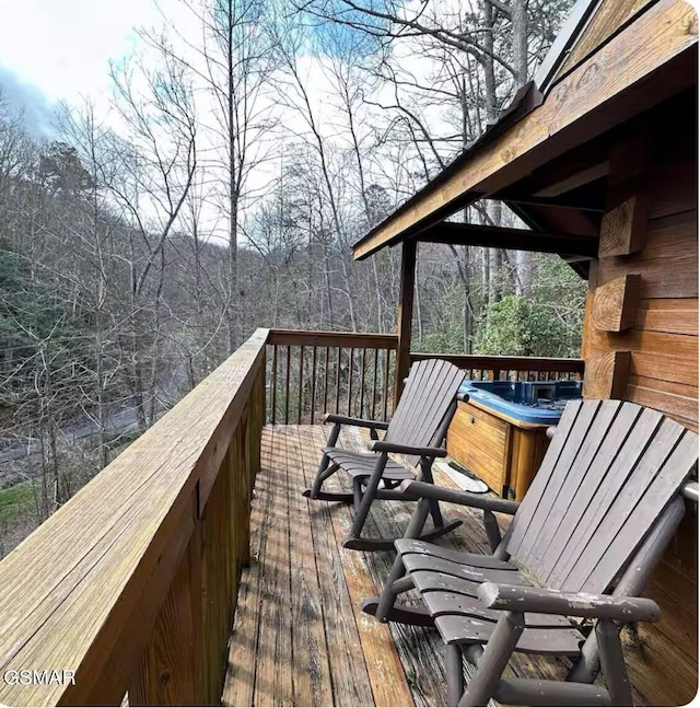 deck featuring a view of trees