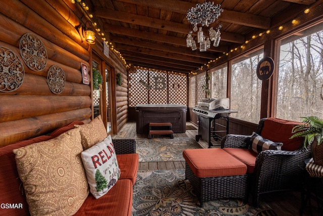 sunroom with beamed ceiling and wood ceiling