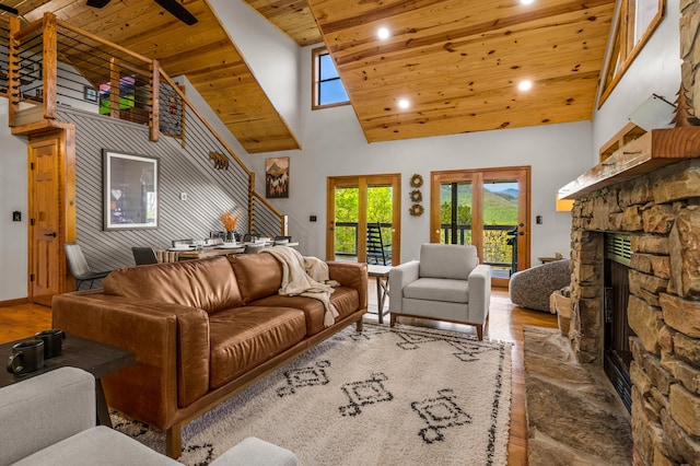 859 Pinnacle Vista Rd, Gatlinburg, TN 37738 - living area featuring wood finished floors, wooden ceiling, a stone fireplace, high vaulted ceiling, and recessed lighting