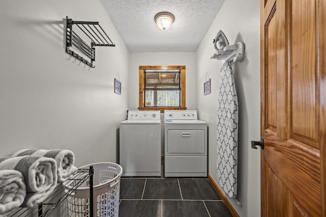 859 Pinnacle Vista Rd, Gatlinburg, TN 37738 - laundry room with washing machine and clothes dryer, a textured ceiling, and dark tile patterned flooring
