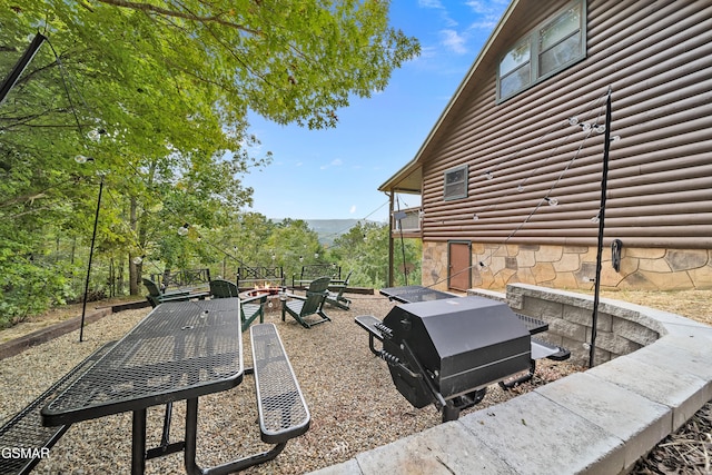 859 Pinnacle Vista Rd, Gatlinburg, TN 37738 - view of patio / terrace with an outdoor fire pit, a grill, and a mountain view