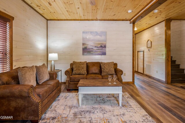 923 Osprey Way, Pigeon Forge, TN 37863 - living area with wooden walls, wood finished floors, wooden ceiling, and stairs