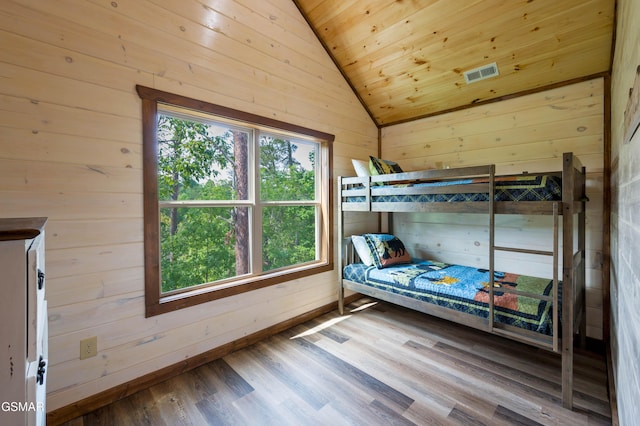 923 Osprey Way, Pigeon Forge, TN 37863 - bedroom featuring lofted ceiling, wood finished floors, wooden walls, and wooden ceiling