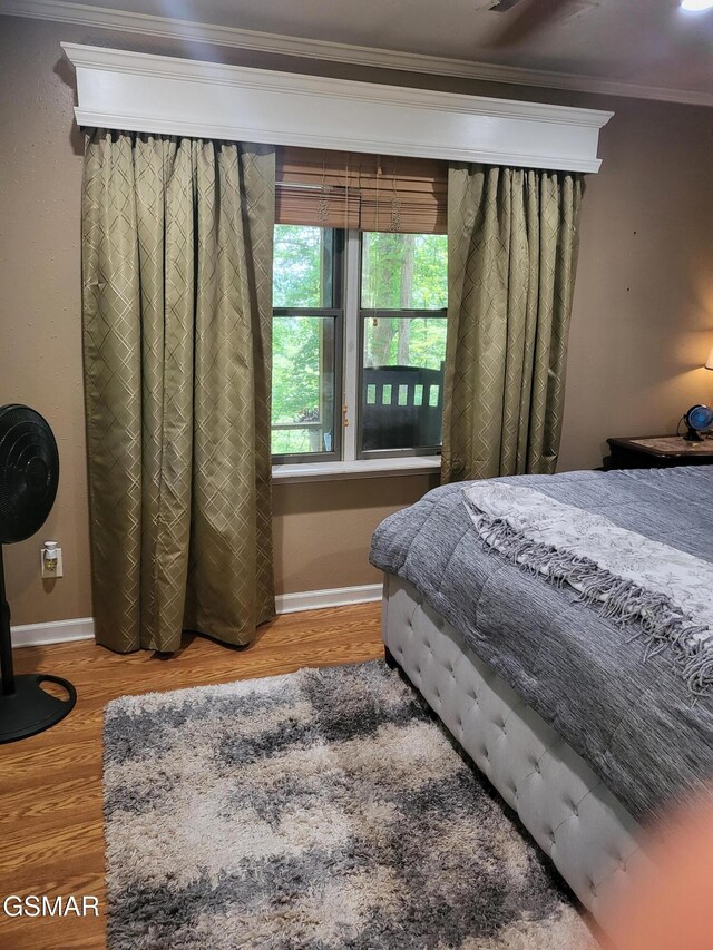 928 E Cross Rd, Dandridge, TN 37725 - bedroom with crown molding, wood finished floors, and baseboards