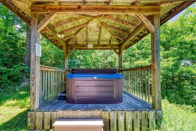 wooden deck featuring a gazebo and a hot tub