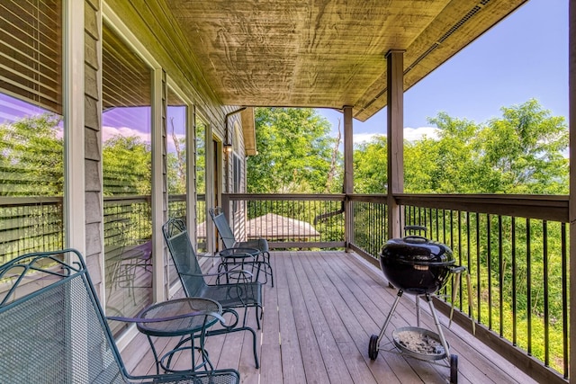 wooden terrace featuring grilling area