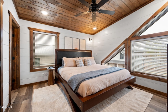 bedroom featuring wood ceiling, wooden walls, vaulted ceiling, and dark wood finished floors