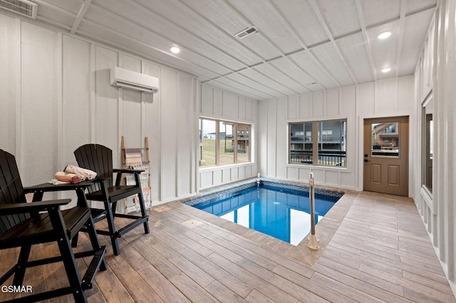 pool featuring a wall mounted AC