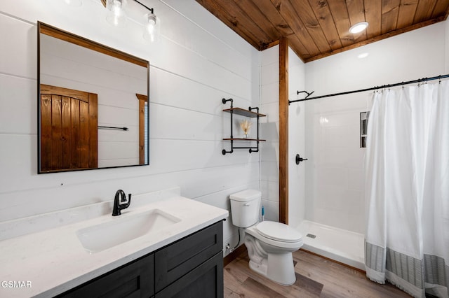 full bathroom featuring toilet, wood finished floors, vanity, wood ceiling, and a stall shower