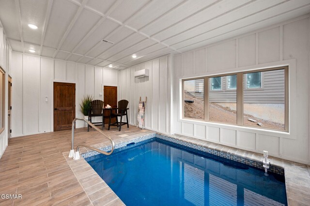 view of pool featuring a wall mounted air conditioner