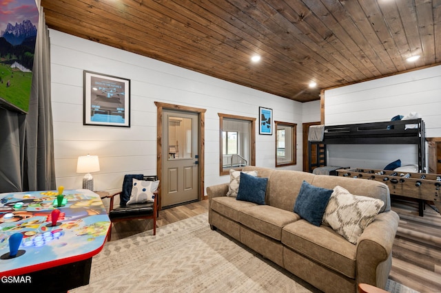 living room with recessed lighting, wood ceiling, and light wood-style flooring