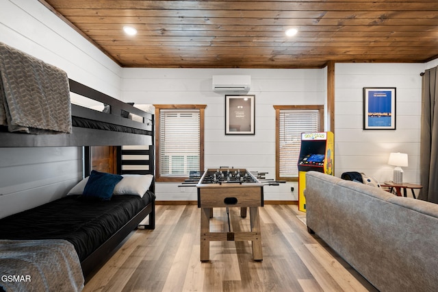 bedroom featuring light wood-type flooring, a wall mounted air conditioner, wood ceiling, and recessed lighting