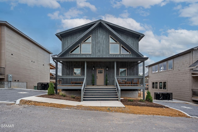 view of front of home featuring a porch and central air condition unit