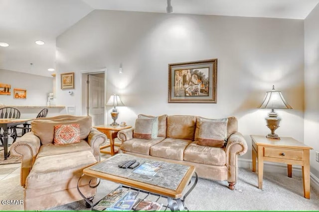 living room with carpet floors and vaulted ceiling