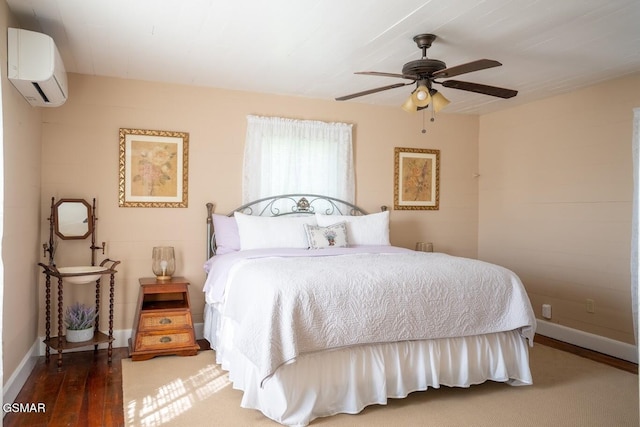 bedroom with a wall mounted air conditioner, dark hardwood / wood-style flooring, and ceiling fan