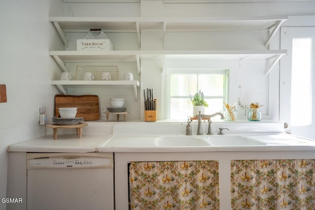 interior space featuring dishwasher and sink