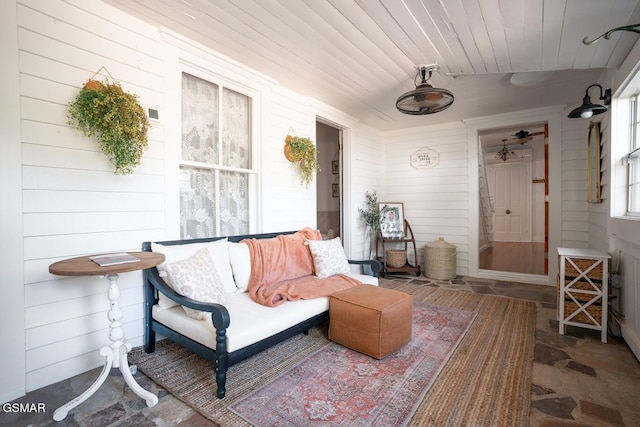 interior space featuring wood walls and wood ceiling