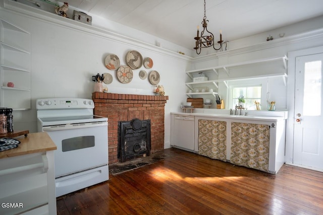 kitchen featuring a brick fireplace, an inviting chandelier, dark hardwood / wood-style floors, pendant lighting, and white appliances