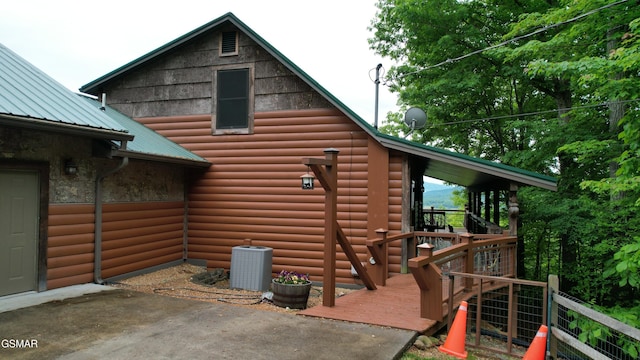 3644 Wears Mountain Ln, Sevierville, TN 37862 - view of side of home featuring cooling unit, faux log siding, and metal roof
