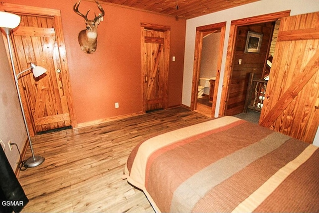 3644 Wears Mountain Ln, Sevierville, TN 37862 - bedroom with wood finished floors, wooden ceiling, and baseboards