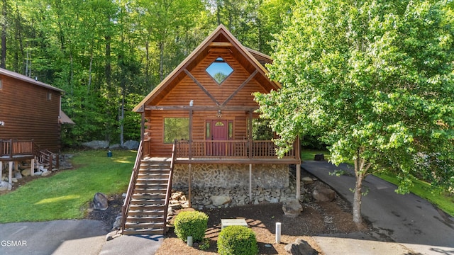 212 Forrest Loop Way, Gatlinburg, TN 37738 - cabin with stairs, log siding, and a front yard