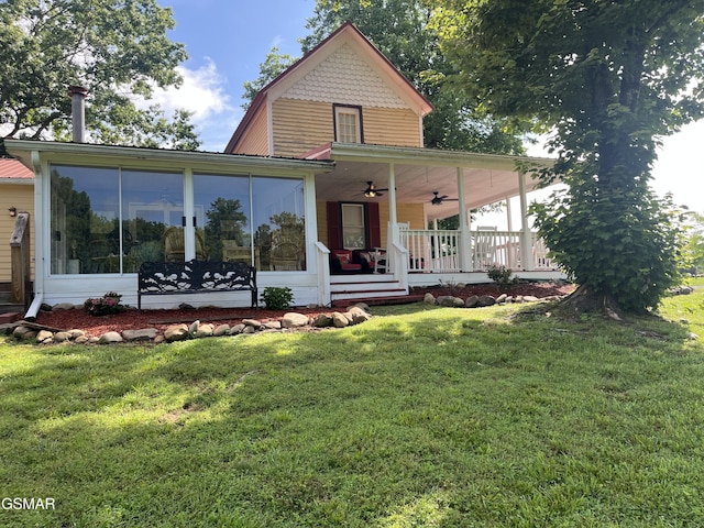 523 Orchard Valley Way Unit 432, Sevierville, TN 37862 - farmhouse inspired home with a ceiling fan, a front lawn, a sunroom, and covered porch
