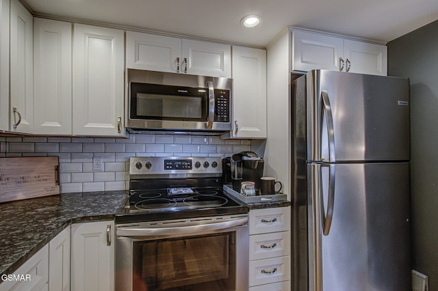 523 Orchard Valley Way Unit 432, Sevierville, TN 37862 - kitchen featuring appliances with stainless steel finishes, white cabinetry, decorative backsplash, and recessed lighting