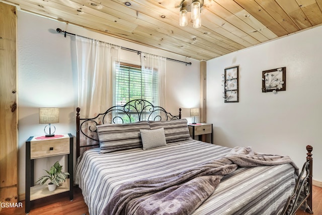3230 Cove Creek Way, Sevierville, TN 37862 - bedroom featuring wood finished floors, wooden ceiling, and baseboards