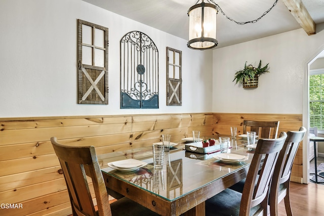 3230 Cove Creek Way, Sevierville, TN 37862 - dining area featuring a chandelier, a wainscoted wall, wood finished floors, wooden walls, and beamed ceiling