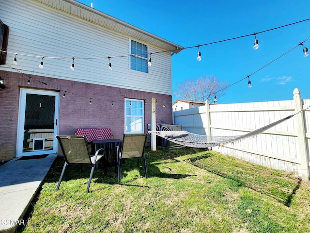 2904 Boyds Creek Hwy Unit 4, Sevierville, TN 37876 - back of house featuring a fenced backyard and brick siding